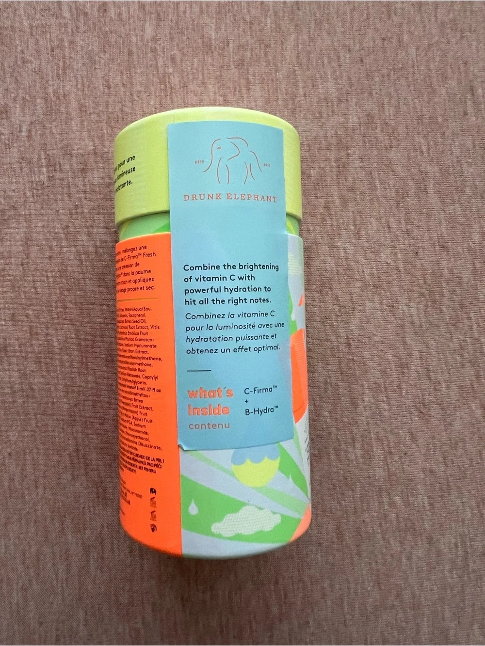 Drunk Elephant Hydrating Serum Tube — Lime Green with Orange Accents